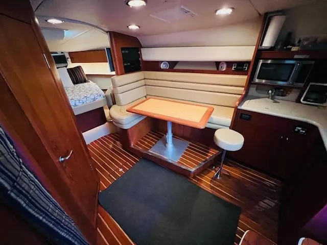  Yacht Photos Pics Interior of 2003 Tiara Yachts 3800 Open, featuring cozy seating and modern amenities.