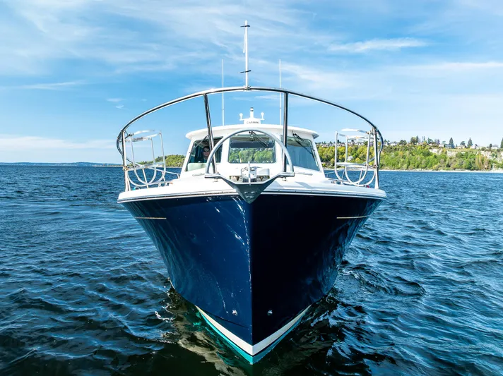 Tangled Up In Blue Yacht Photos Pics 2013 Back Cove 37 boat on open water under clear blue sky.