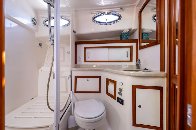 Tangled Up In Blue Yacht Photos Pics Luxurious bathroom in 2013 Back Cove 37 yacht with modern fixtures and elegant wood accents.