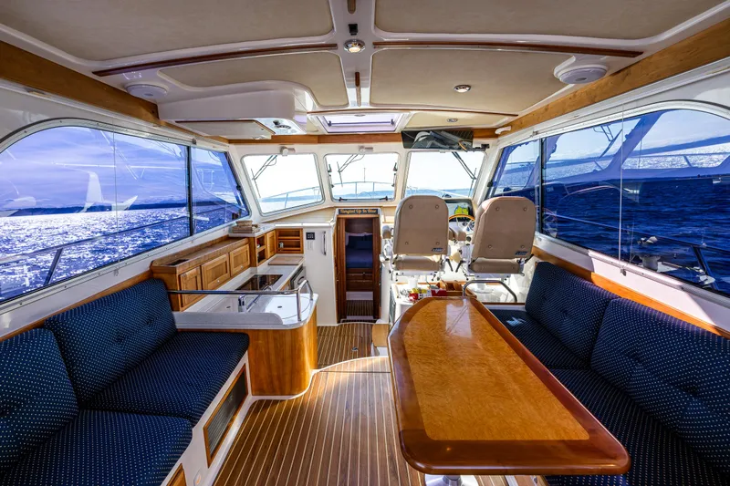 Tangled Up In Blue Yacht Photos Pics Luxurious 2013 Back Cove 37 yacht interior with elegant seating and ocean view.