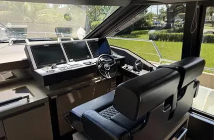  Yacht Photos Pics Cockpit of 2018 Prestige 680 yacht with modern navigation systems and luxurious seating.