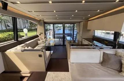  Yacht Photos Pics Luxurious interior of a 2018 Prestige 680 yacht with elegant seating and large windows.