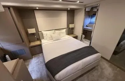  Yacht Photos Pics Luxurious bedroom interior of 2018 Prestige 680 yacht with modern design and cozy ambiance.