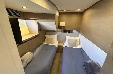  Yacht Photos Pics Twin cabin interior of 2018 Prestige 680 yacht, featuring modern design and cozy bedding.