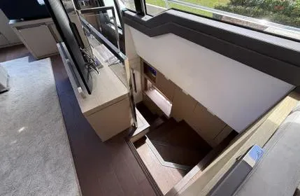  Yacht Photos Pics Staircase inside 2018 Prestige 680 yacht, featuring modern interior design.