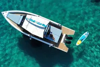 Aerial view of 2021 Scorpion 40 boat on clear turquoise water.