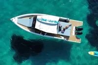 Aerial view of 2021 Scorpion 40 boat on clear turquoise water.