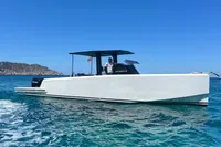 2021 Scorpion 40 boat cruising on clear blue water under a bright sky.