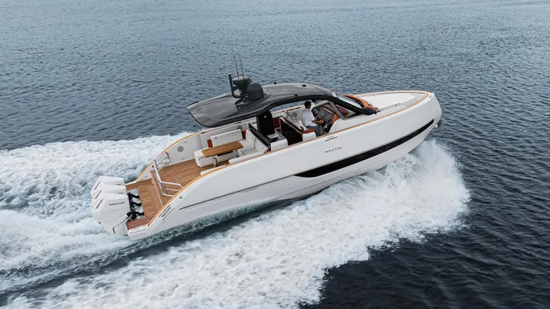  Yacht Photos Pics 2025 Invictus TT 420S luxury yacht cruising on open water.