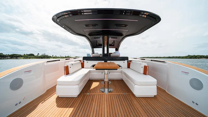  Yacht Photos Pics Luxurious 2025 Invictus TT 420S yacht interior with sleek seating and wooden deck.