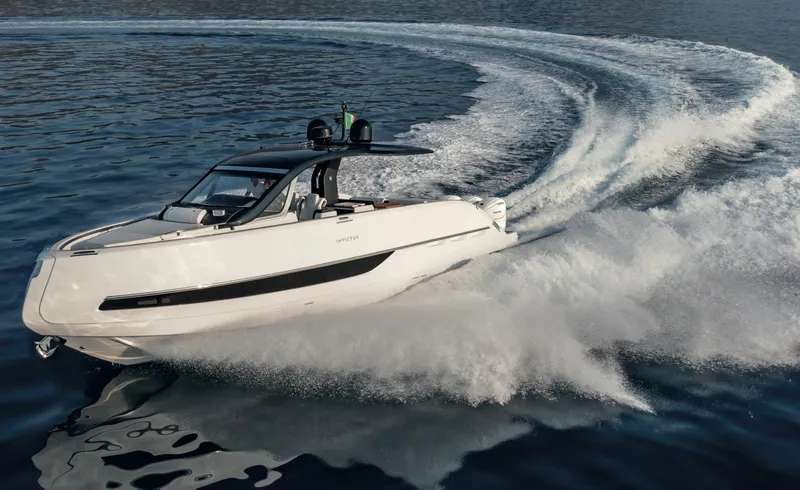  Yacht Photos Pics 2025 Invictus TT 420S luxury yacht cruising on open water.