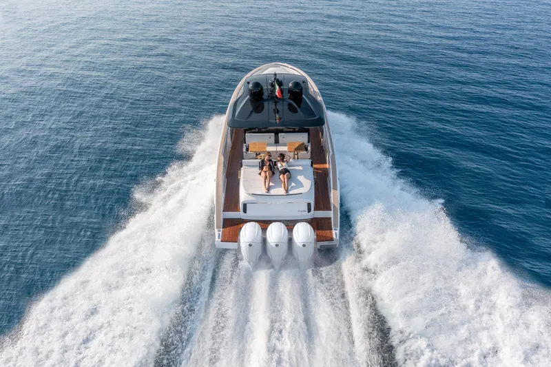  Yacht Photos Pics 2025 Invictus TT 420S yacht cruising on open water, aerial view.