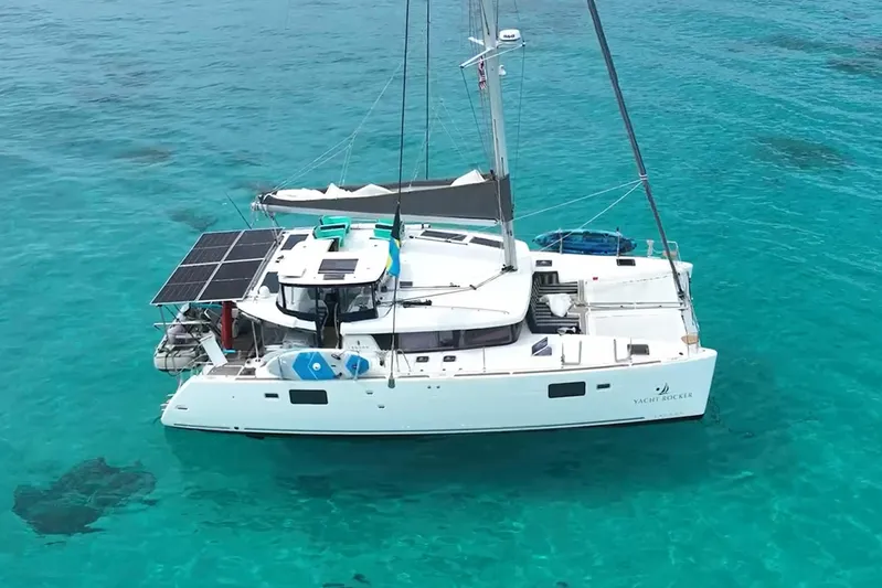  Yacht Photos Pics 2018 Lagoon 450 s catamaran with solar panels on turquoise water.