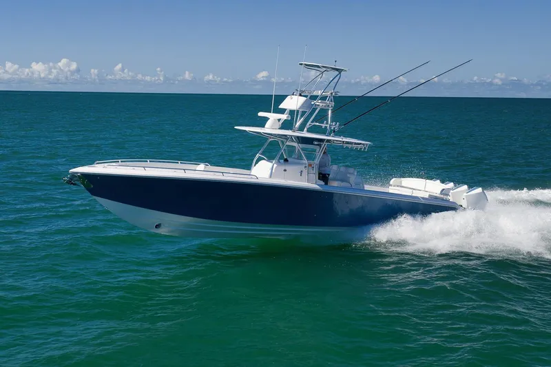  Yacht Photos Pics 2021 Bahama 41 boat cruising on open ocean waters.