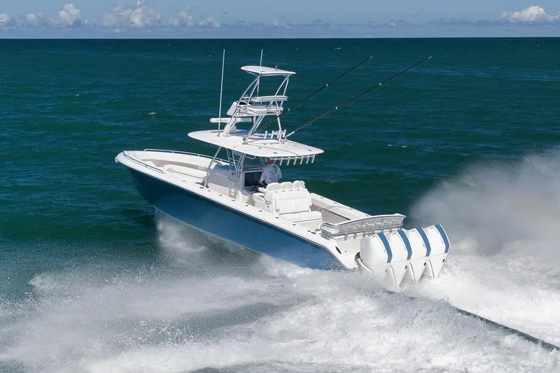  Yacht Photos Pics 2021 Bahama 41 boat cruising on open ocean with powerful engines.