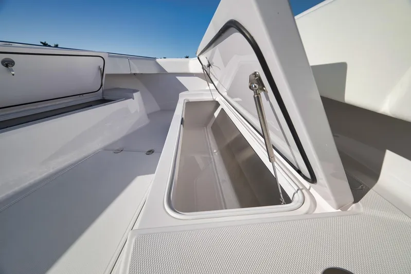  Yacht Photos Pics 2021 Bahama 41 boat storage compartment with open hatch, showcasing spacious interior.
