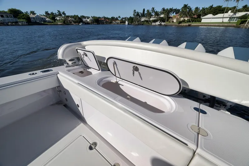  Yacht Photos Pics 2021 Bahama 41 boat interior with open storage compartments on a sunny day.