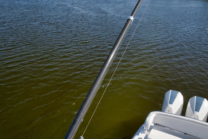  Yacht Photos Pics Fishing rod on a 2021 Bahama 41 boat over calm water.