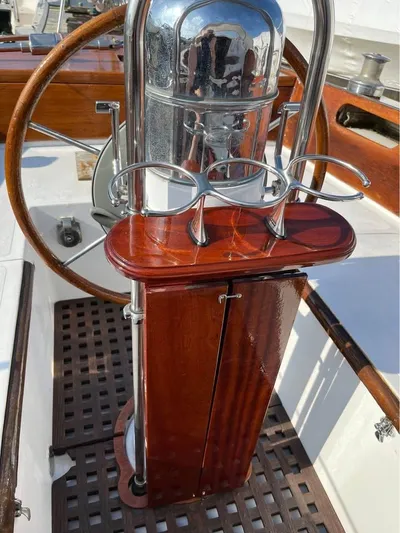 Perelandra Yacht Photos Pics Hinckley Bermuda 40 sailboat helm with wooden wheel and polished metal details, 1968 model.