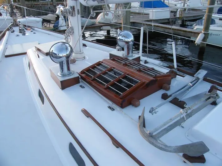 Perelandra Yacht Photos Pics 1968 Hinckley Bermuda 40 sailboat deck with winches and anchor, docked at marina.