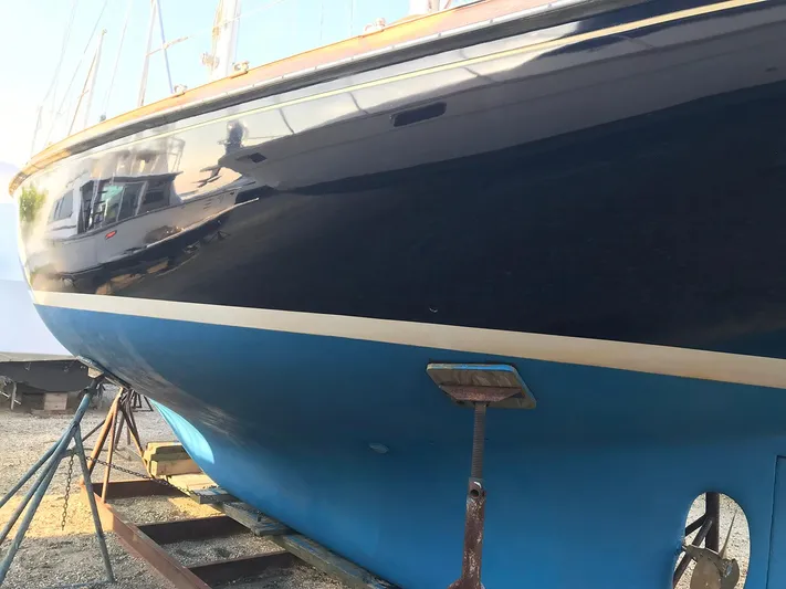 Perelandra Yacht Photos Pics 1968 Hinckley Bermuda 40 sailboat on dry dock, showcasing sleek blue hull design.