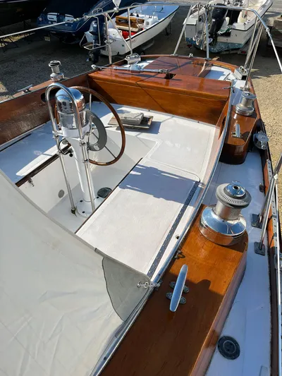 Perelandra Yacht Photos Pics 1968 Hinckley Bermuda 40 sailboat cockpit with wooden finish and steering wheel.