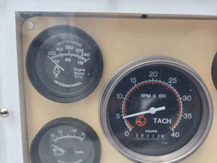 Perelandra Yacht Photos Pics Close-up of 1968 Hinckley Bermuda 40 engine gauges, showing RPM and temperature.