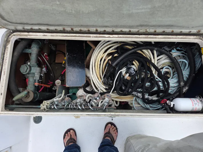 Perelandra Yacht Photos Pics Storage compartment of a 1968 Hinckley Bermuda 40 sailboat with ropes and equipment.