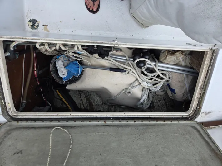 Perelandra Yacht Photos Pics Storage compartment of a 1968 Hinckley Bermuda 40 sailboat with ropes and equipment.