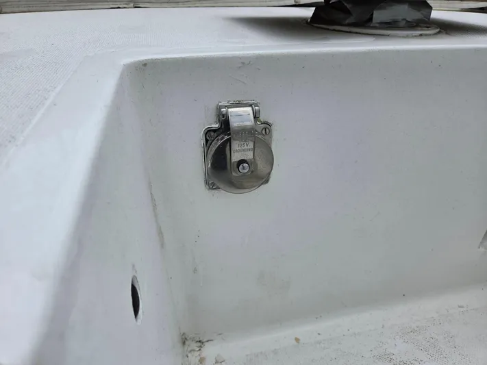 Perelandra Yacht Photos Pics 1968 Hinckley Bermuda 40 boat deck with a metal electrical outlet.