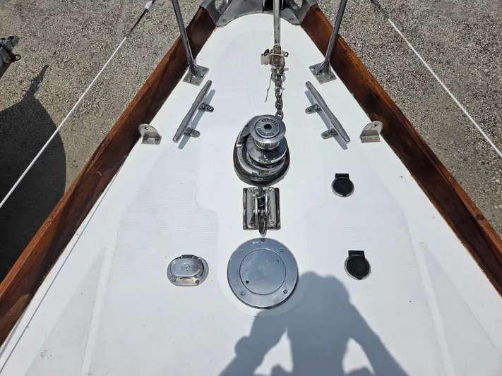 Perelandra Yacht Photos Pics Bow of 1968 Hinckley Bermuda 40 sailboat with anchor chain and winch.