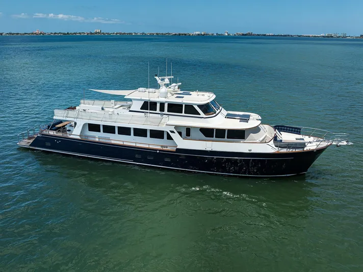 Agave Yacht Photos Pics Luxury 2011 Marlow 97 Explorer yacht cruising on calm blue waters.