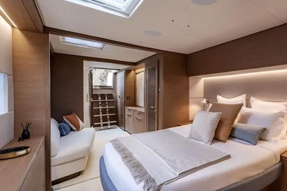  Yacht Photos Pics Luxurious bedroom interior of 2026 Lagoon SIXTY 7 yacht with modern design and cozy ambiance.
