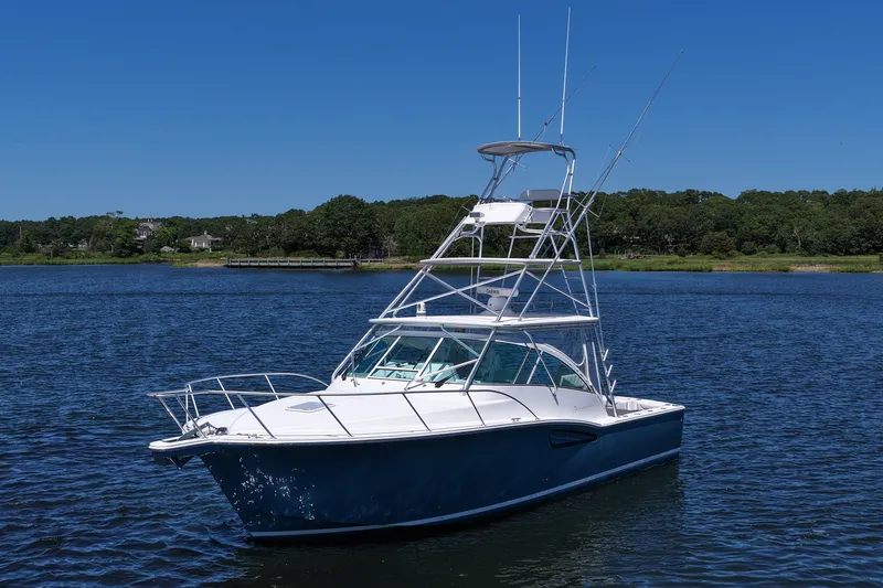  Yacht Photos Pics 2018 Albemarle 36 Express boat on calm water under clear blue sky.