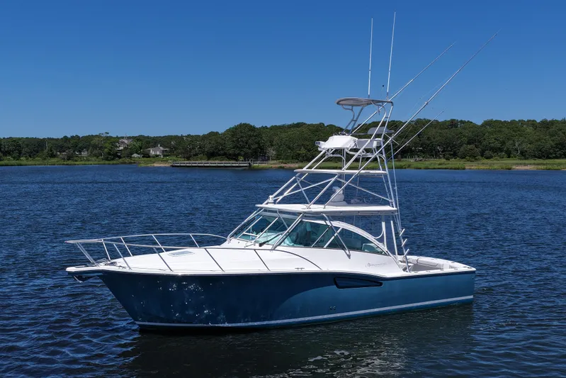  Yacht Photos Pics 2018 Albemarle 36 Express boat on calm water under clear blue sky.