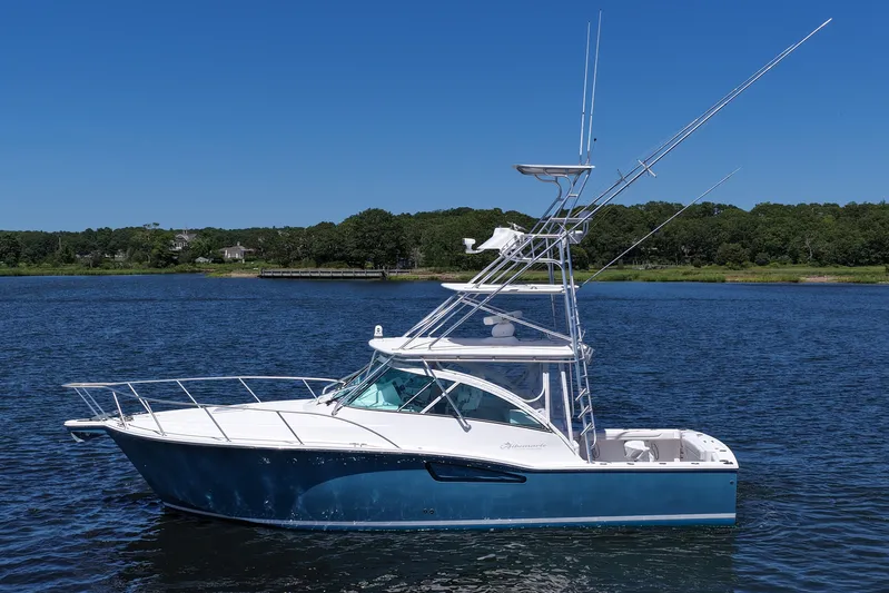 Yacht Photos Pics 2018 Albemarle 36 Express boat on calm water with clear blue sky.