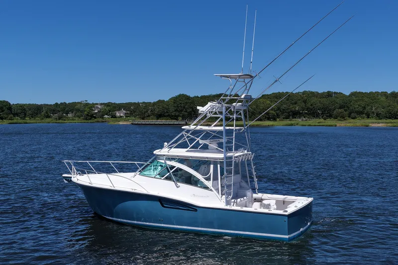  Yacht Photos Pics 2018 Albemarle 36 Express boat on calm water under clear blue sky.