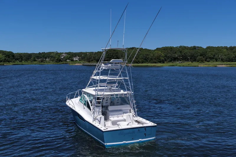  Yacht Photos Pics 2018 Albemarle 36 Express boat on calm water under clear blue sky.