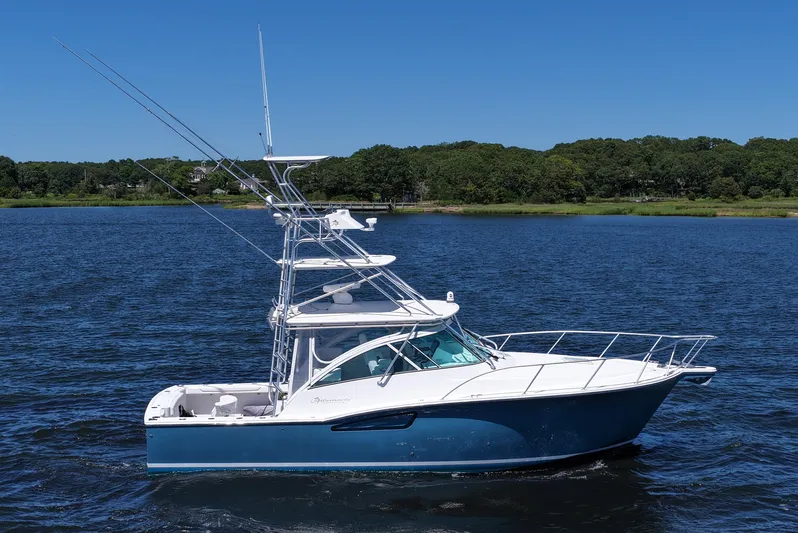  Yacht Photos Pics 2018 Albemarle 36 Express boat on calm water, clear blue sky background.