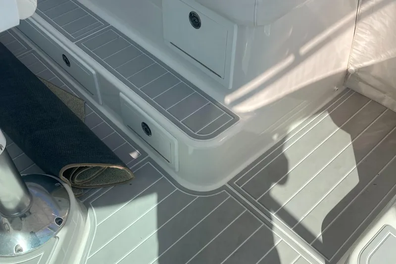  Yacht Photos Pics 2018 Albemarle 36 Express boat interior with rolled carpet and storage compartments.