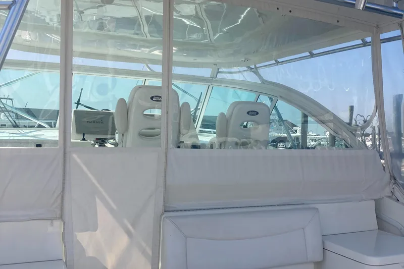  Yacht Photos Pics 2018 Albemarle 36 Express boat interior with white seating and clear enclosure.