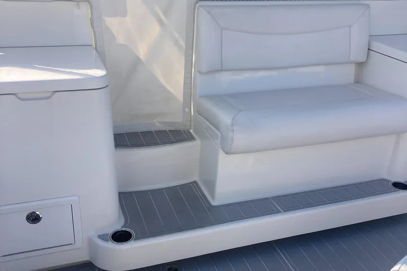 Yacht Photos Pics 2018 Albemarle 36 Express boat interior with white seating and storage compartments.