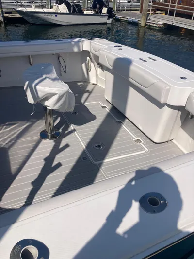  Yacht Photos Pics 2018 Albemarle 36 Express boat deck with seating and covered chair.