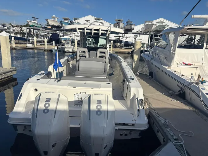  Yacht Photos Pics Boston Whaler 33 OUTRAGE 2022 at marina with twin engines.