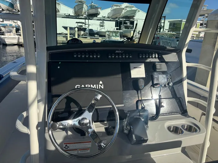  Yacht Photos Pics 2022 Boston Whaler 33 OUTRAGE helm with Garmin navigation system.