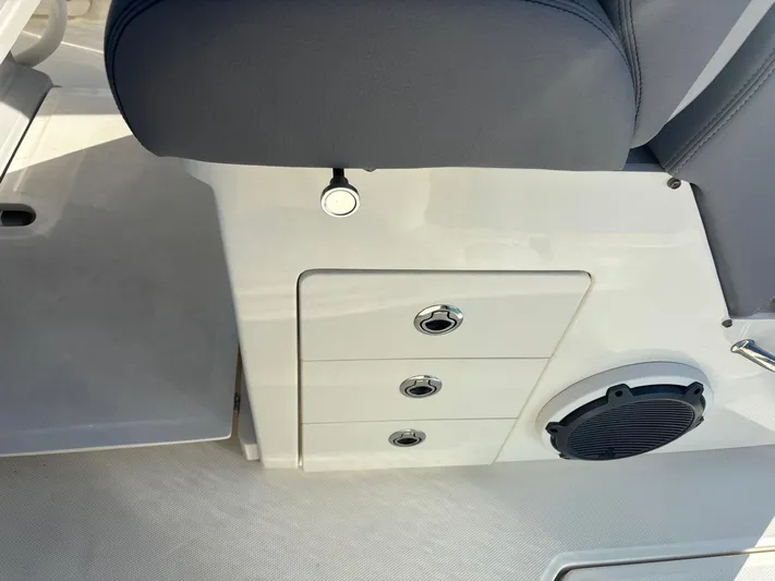  Yacht Photos Pics Interior of 2022 Boston Whaler 33 OUTRAGE with speaker and storage.