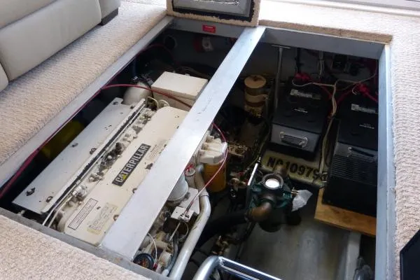  Yacht Photos Pics 1999 Mainship 350 Trawler engine compartment with Caterpillar engine and batteries visible.