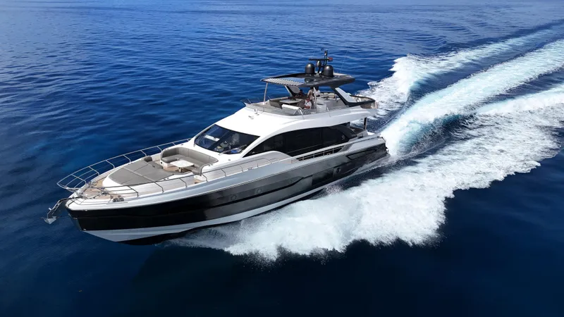  Yacht Photos Pics 2021 Azimut Fly 78 yacht cruising on open sea, leaving a trail of white wake.