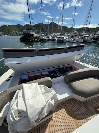  Yacht Photos Pics Azimut Fly 78 yacht deck with seating, storage, and marina view, 2021 model.