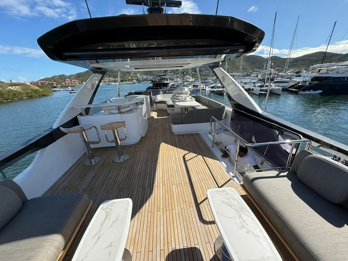 Yacht Photos Pics Luxurious 2021 Azimut Fly 78 yacht deck with elegant seating and scenic marina view.